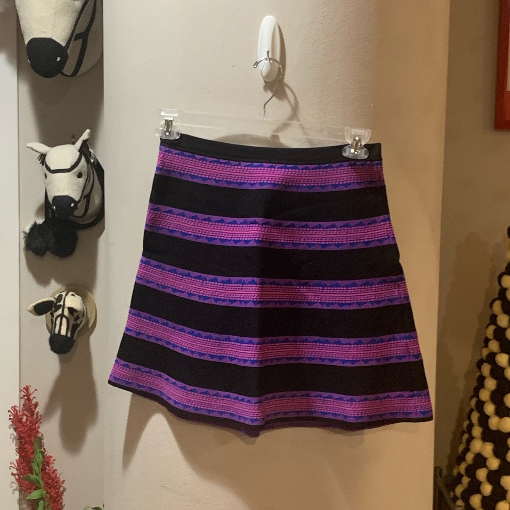 Miami brand mini skirt Sz M. Black with neon pink/blue pattern stripes